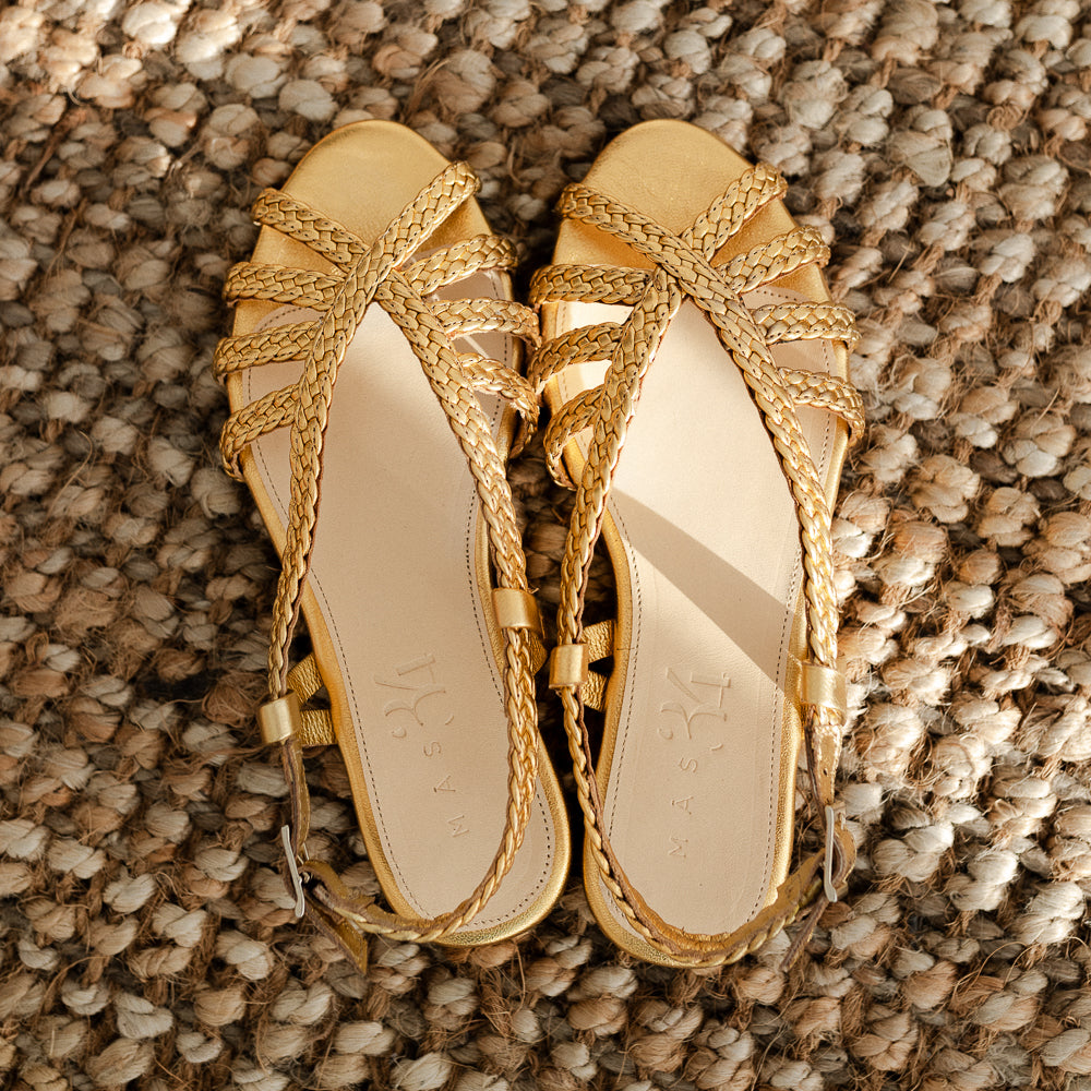 LOURDES FLAT SANDAL IN GOLD LAMINATED LEATHER