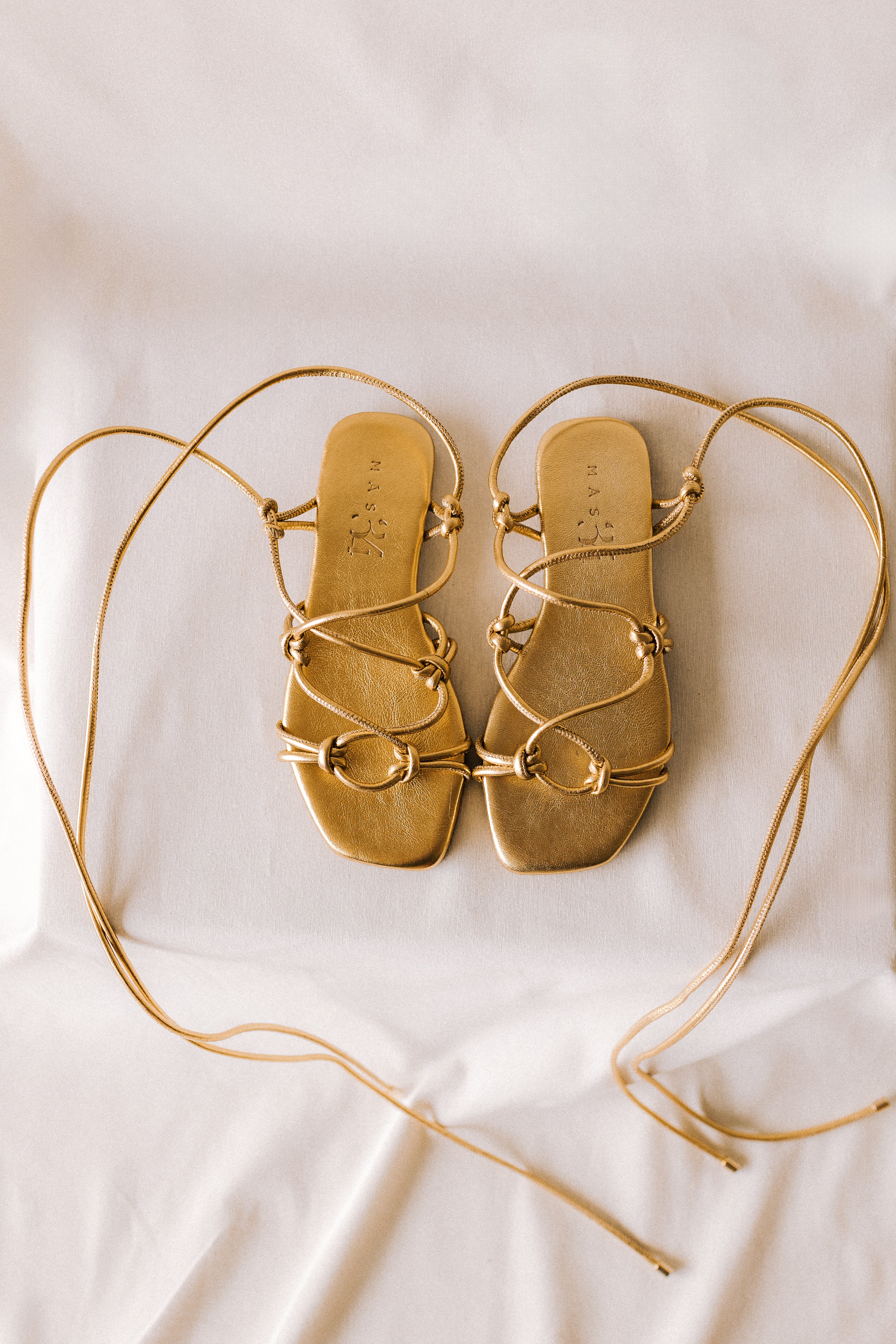 CATY FLAT SANDAL IN GOLD LAMINATED LEATHER