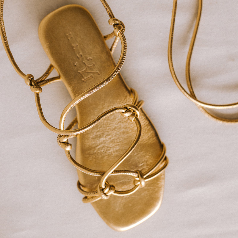 CATY FLAT SANDAL IN GOLD LAMINATED LEATHER