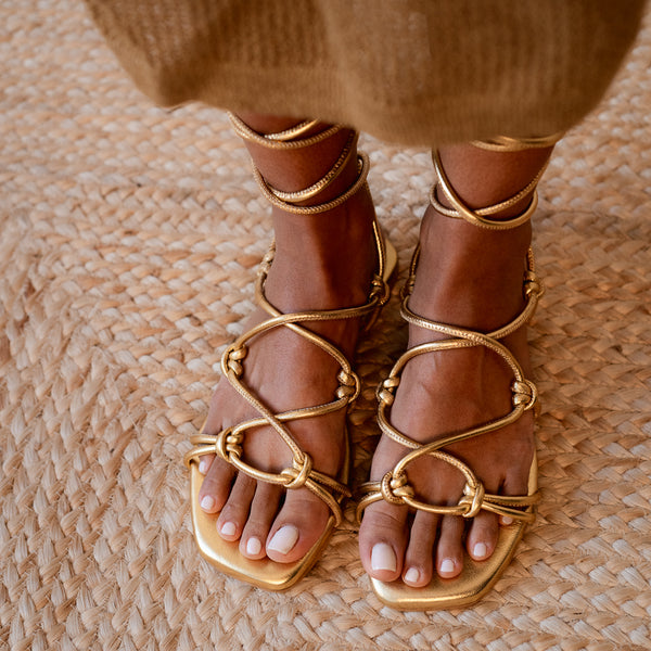 CATY FLAT SANDAL IN GOLD LAMINATED LEATHER