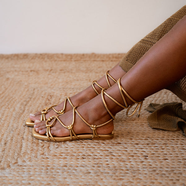 CATY FLAT SANDAL IN GOLD LAMINATED LEATHER